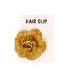Gouden glitterbloem haarclip
